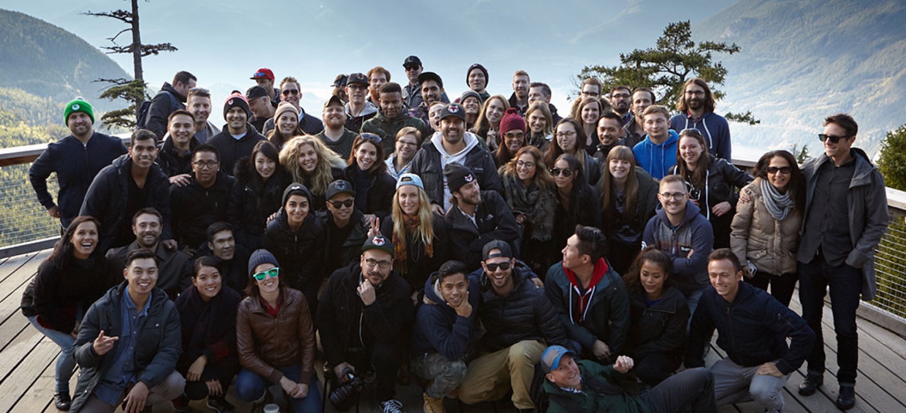 The Foodee team posing on a mountain landing area in Vancouver.